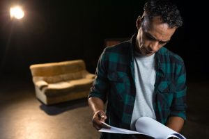 man reads scripts